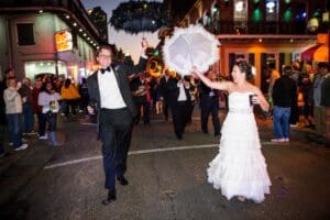 Evening wedding second line parade in the French Quarter