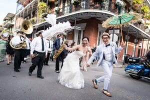 Couple parading down Royal Street in New Orleans French Quarter