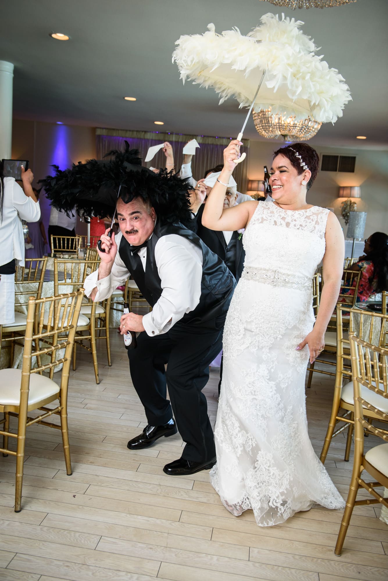 Bride and groom with umbrellas
