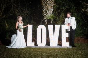 Couple by love sign at Southern Oaks wedding