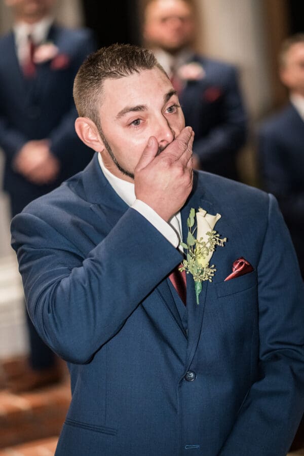 Groom reacts as he sees bride
