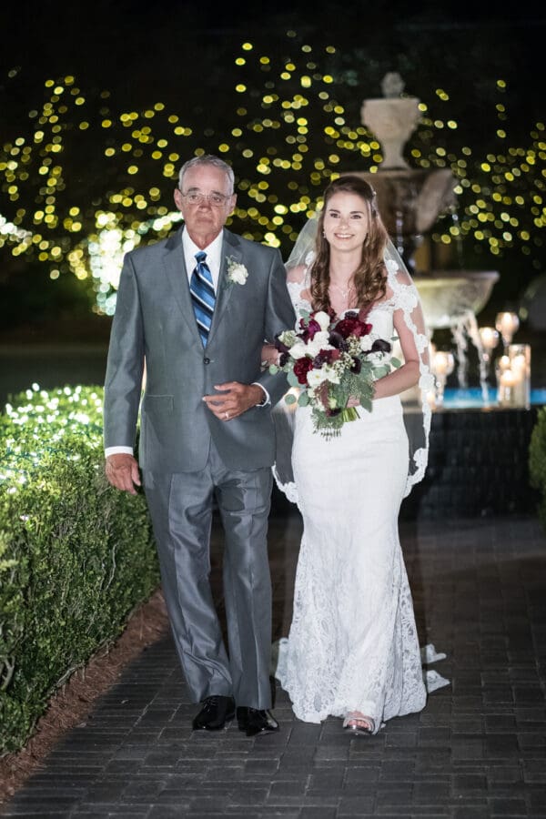 Bride and father walk up the aisle at Southern Oaks
