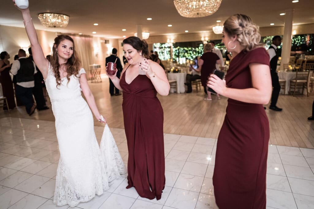Bride dances with bridesmaids