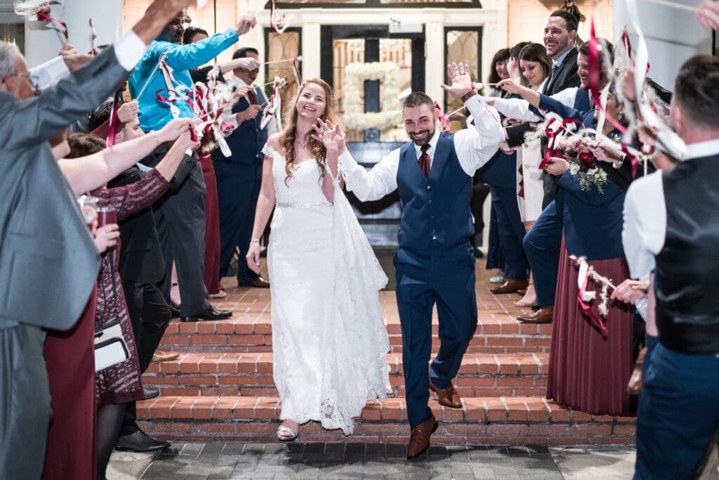 Bride and groom have ribbon wand send-off at Southern Oaks
