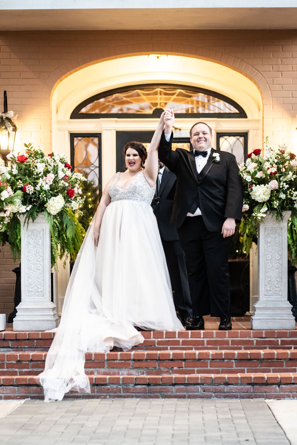 Bride and groom celebrate at the end of their wedding ceremony at Southern Oaks