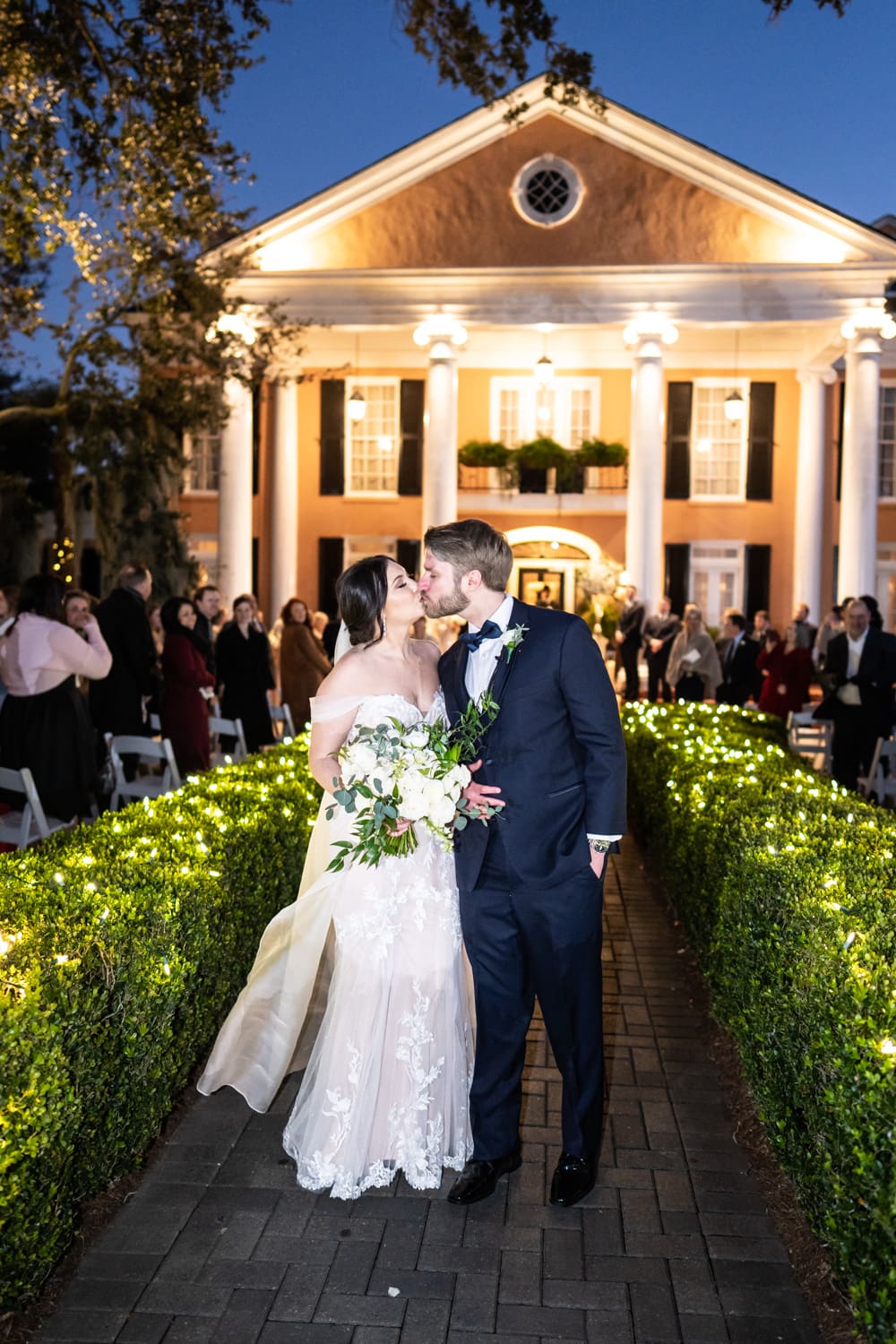 Bride and groom kissing at Southern Oaks wedding ceremony