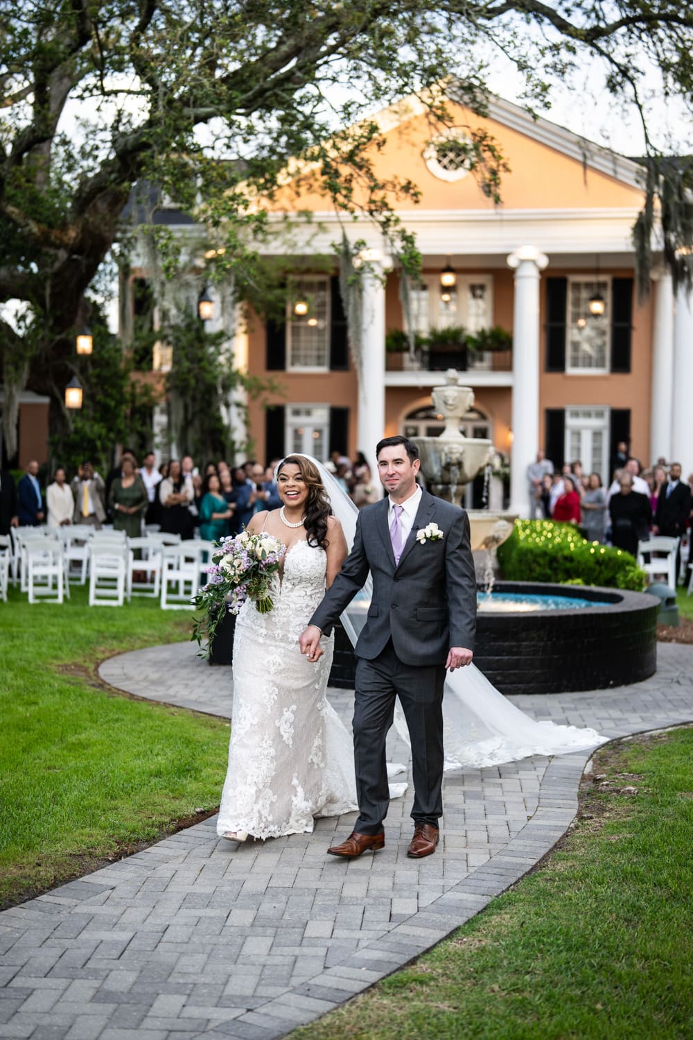 Bride and groom walking down aisle at Southern Oaks wedding