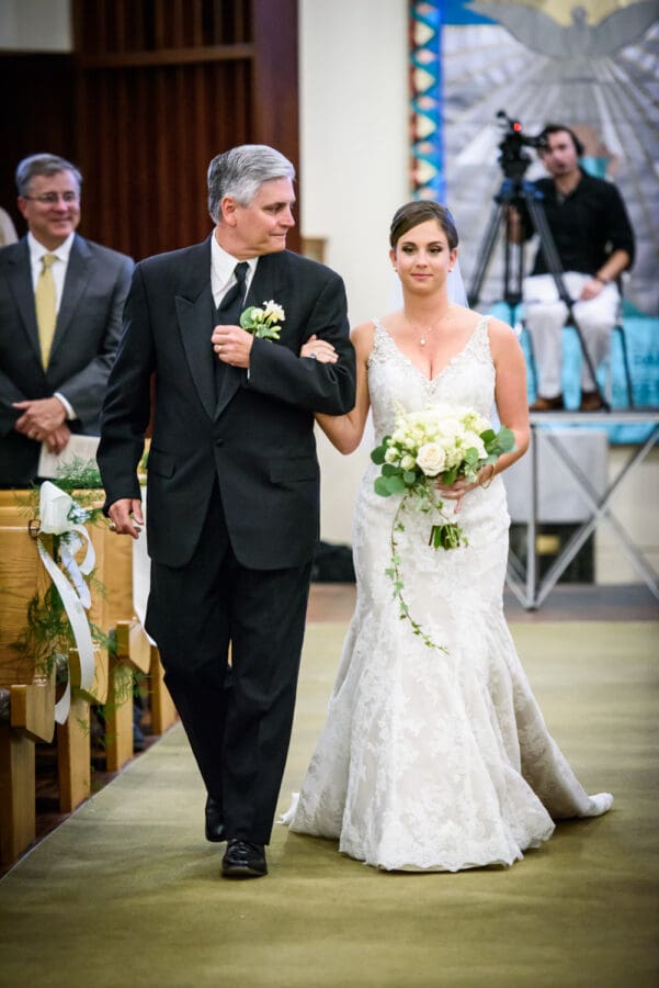 Bride and father walking down aisle