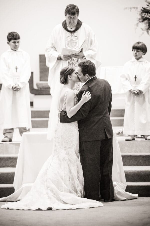 Bride and groom kiss