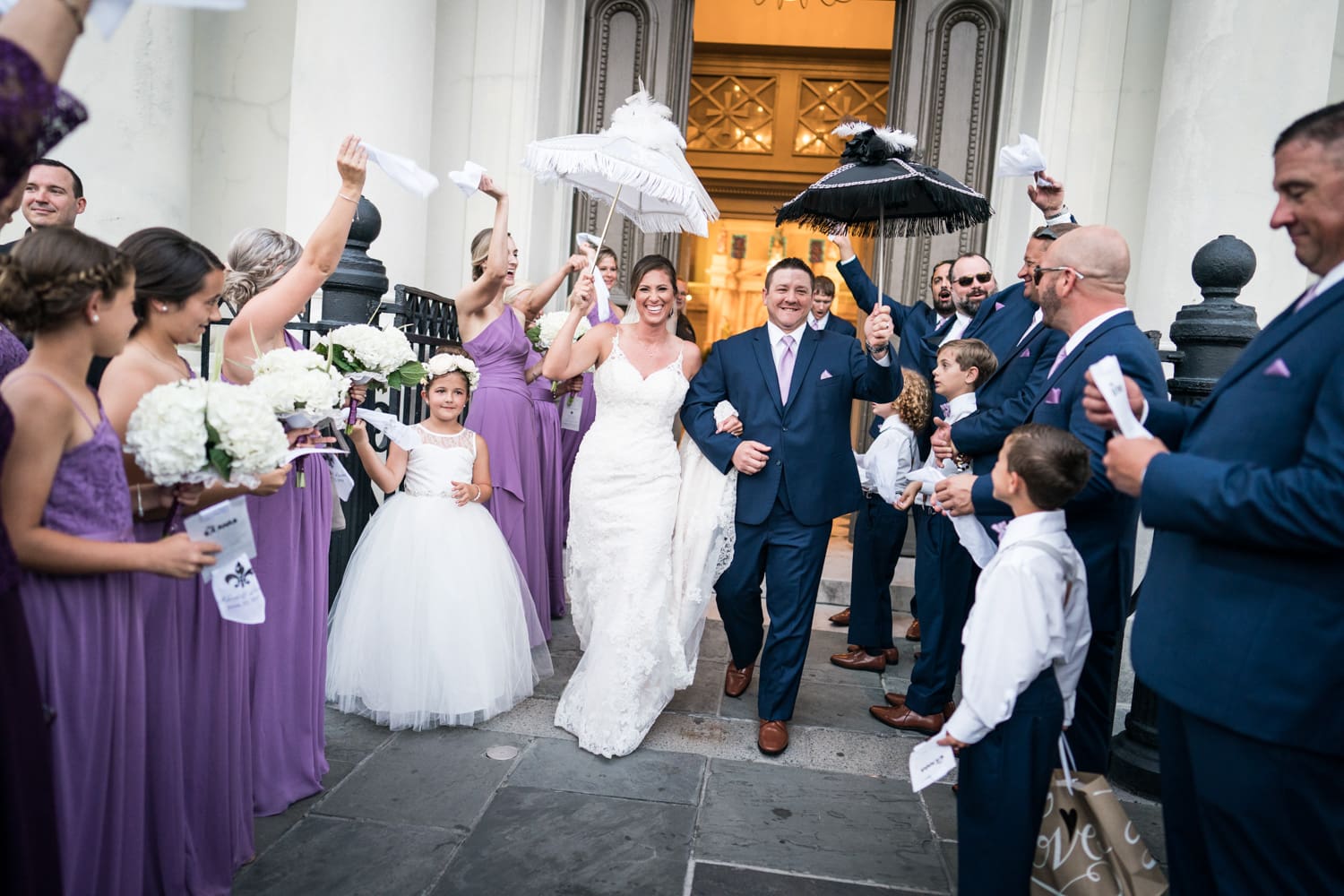 Couple leaving St. Louis Cathedral after their wedding ceremony