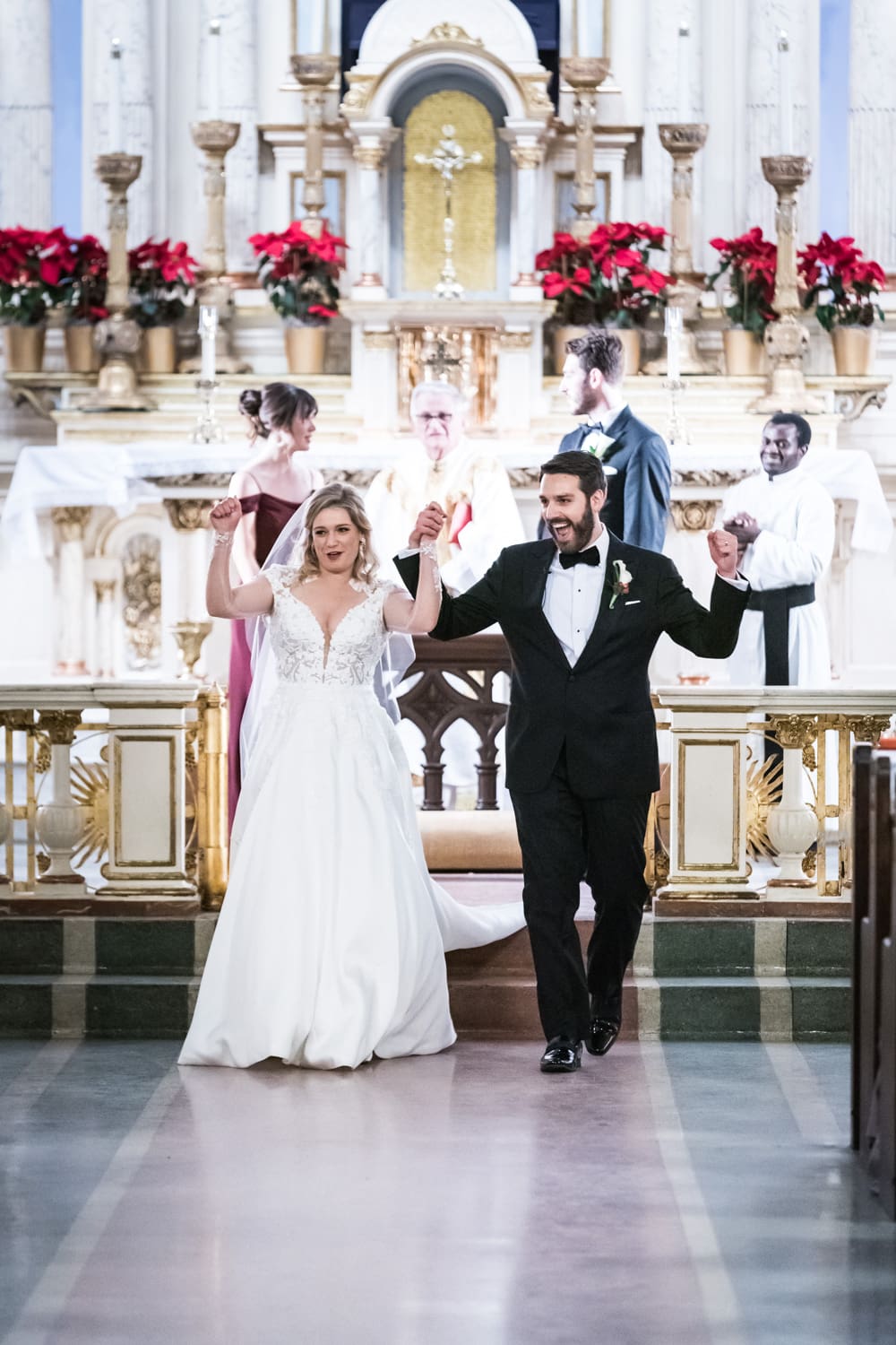 Couple celebrates at end of wedding ceremony at St. Mary's in New Orleans