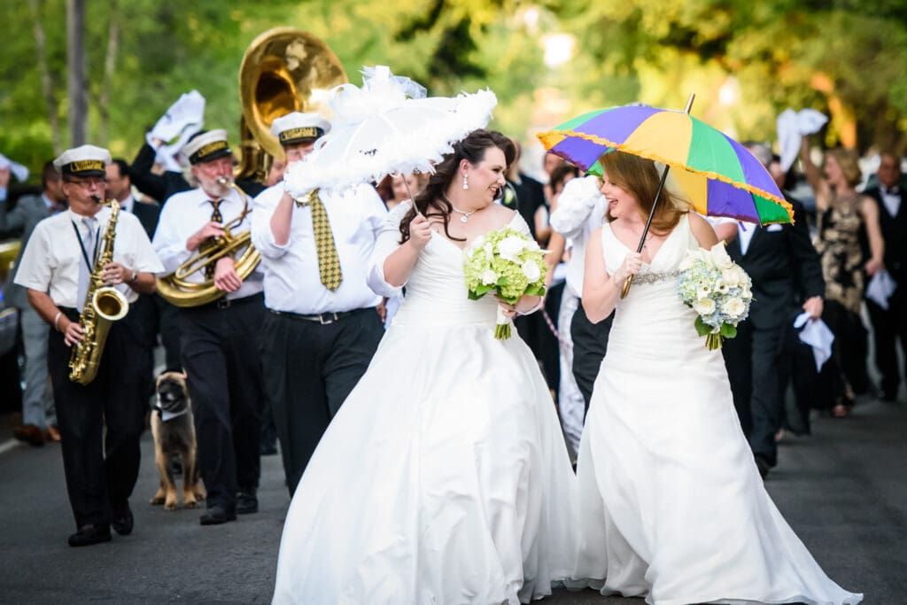 Brides in wedding second line parade