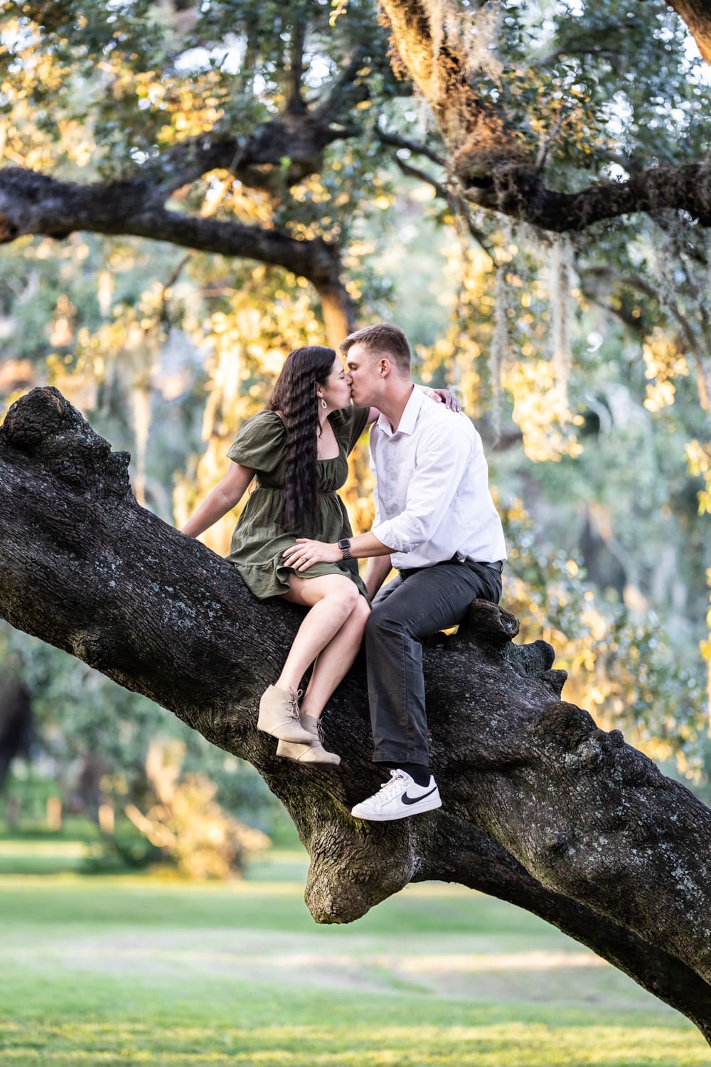 Couple sitting in Tree of Life in Audubon Park