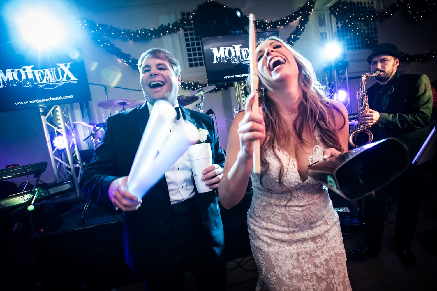 Bride and groom having fun at Boudreaux's wedding in Baton Rouge