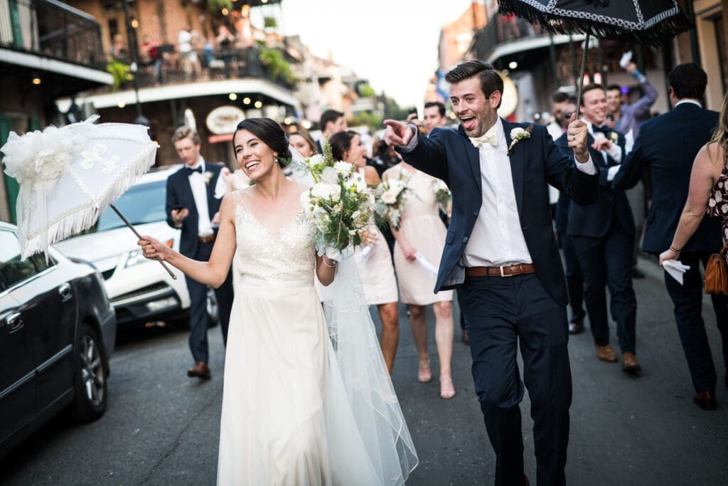 Groom pointing during second line parade in the French Quarter