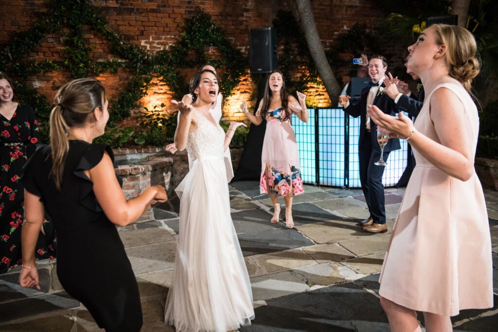 Bride and bridesmaids dance at Broussard's