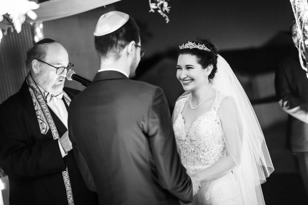 Bride smiles at groom