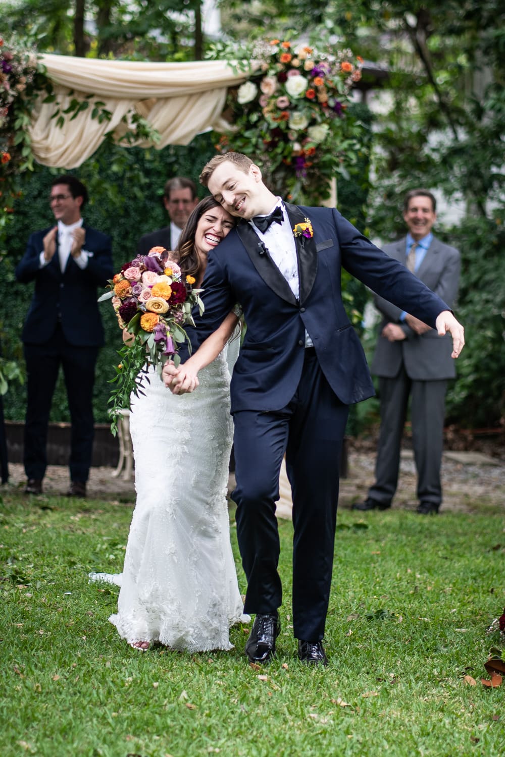 Bride and groom walking down aisle at Elms Mansion wedding ceremony