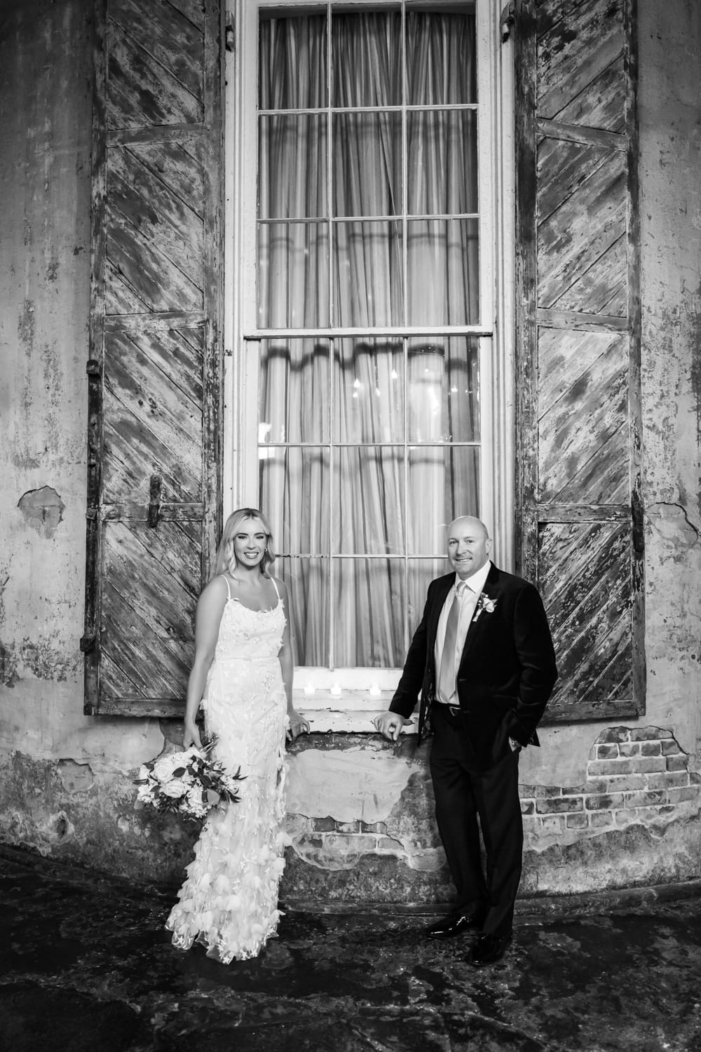 Couple standing by window at Latrobe's on Royal