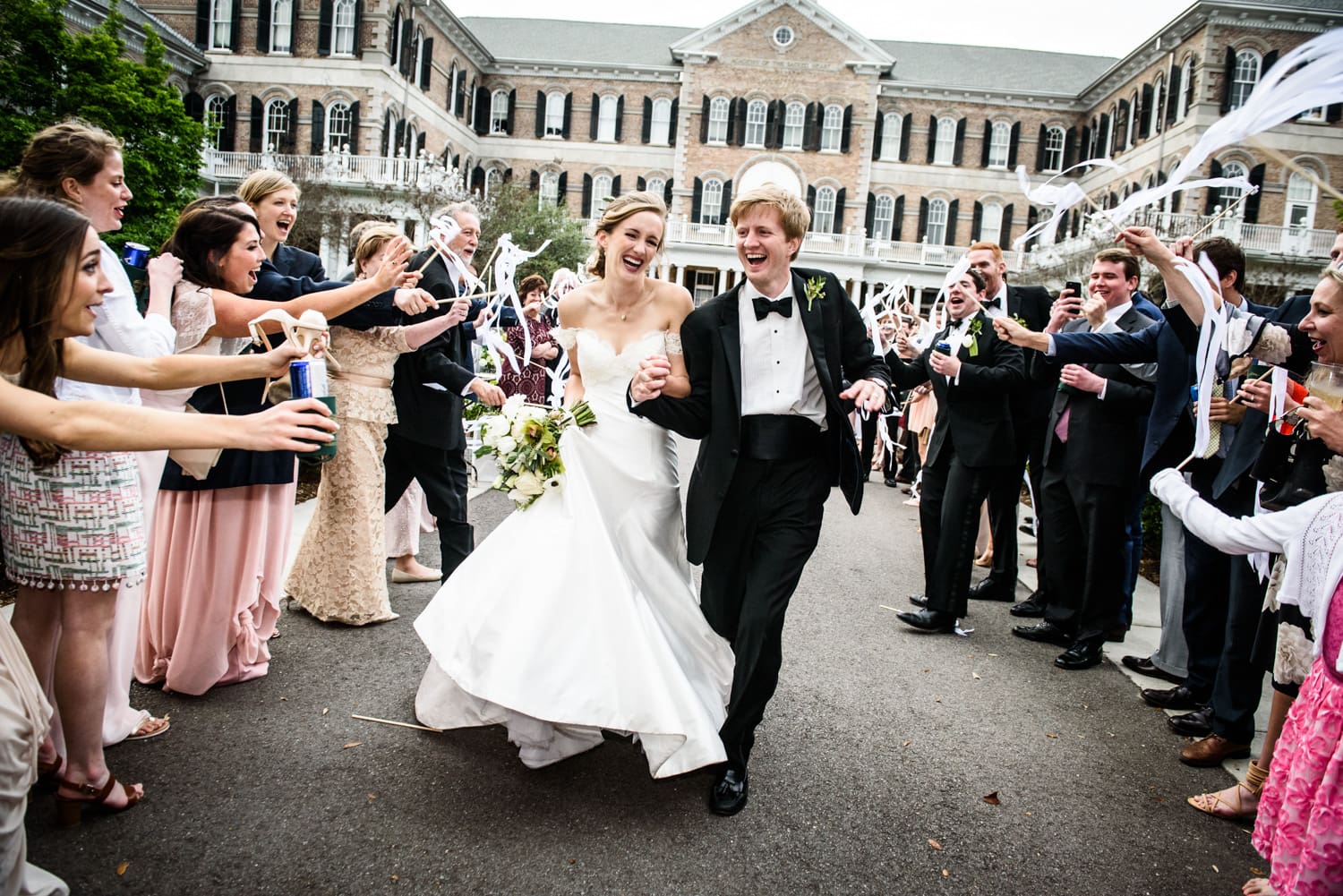 Bride and groom depart wedding at Sacred Heart in New Orleans