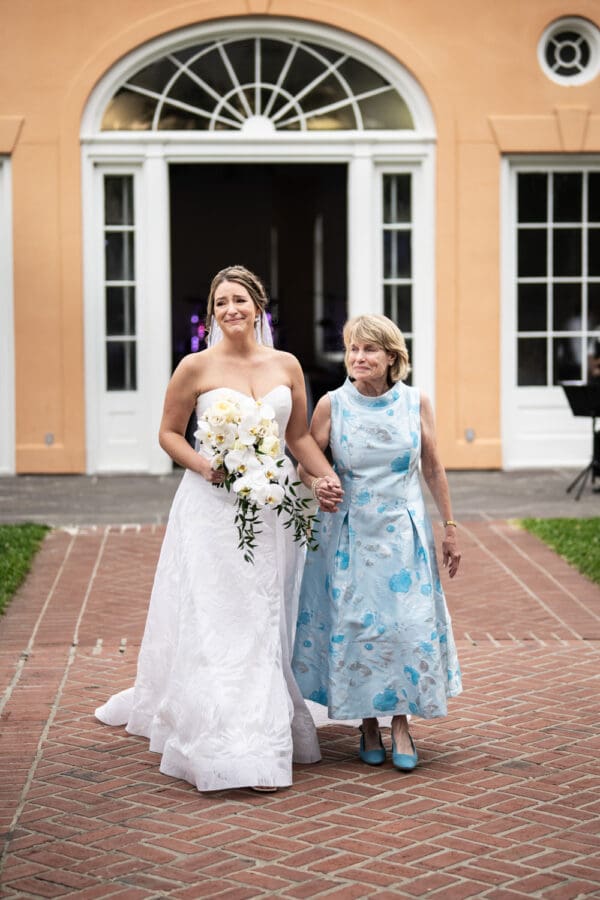 Bride and mother walk down aisle at Camellia Gardens wedding in City Park