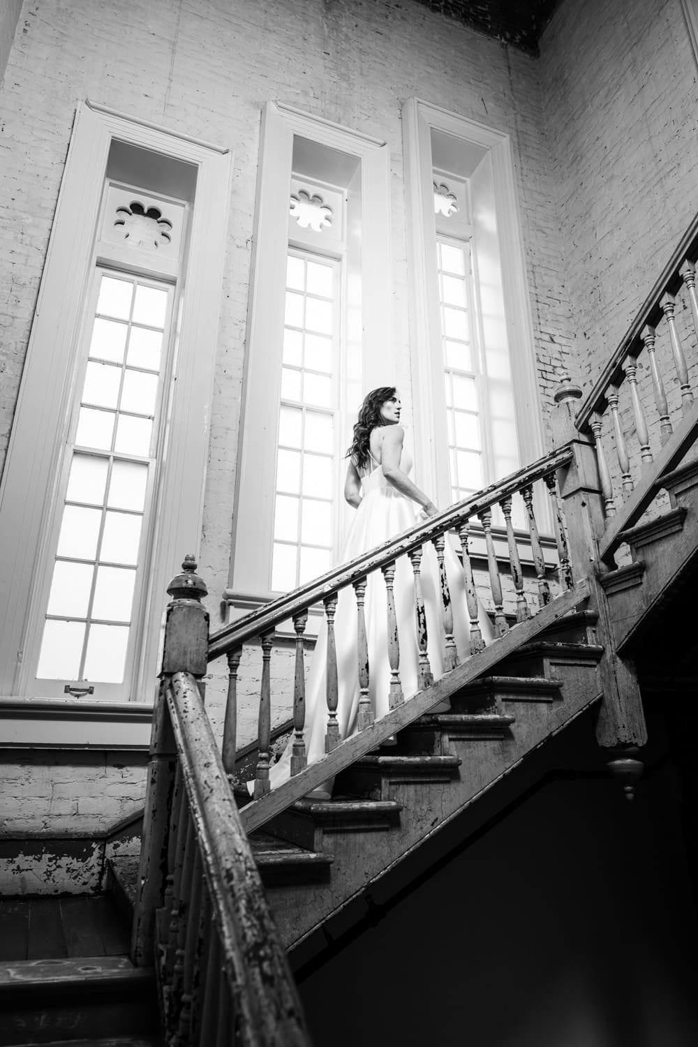 Bride walking up stairs during Felicity Church bridal portrait