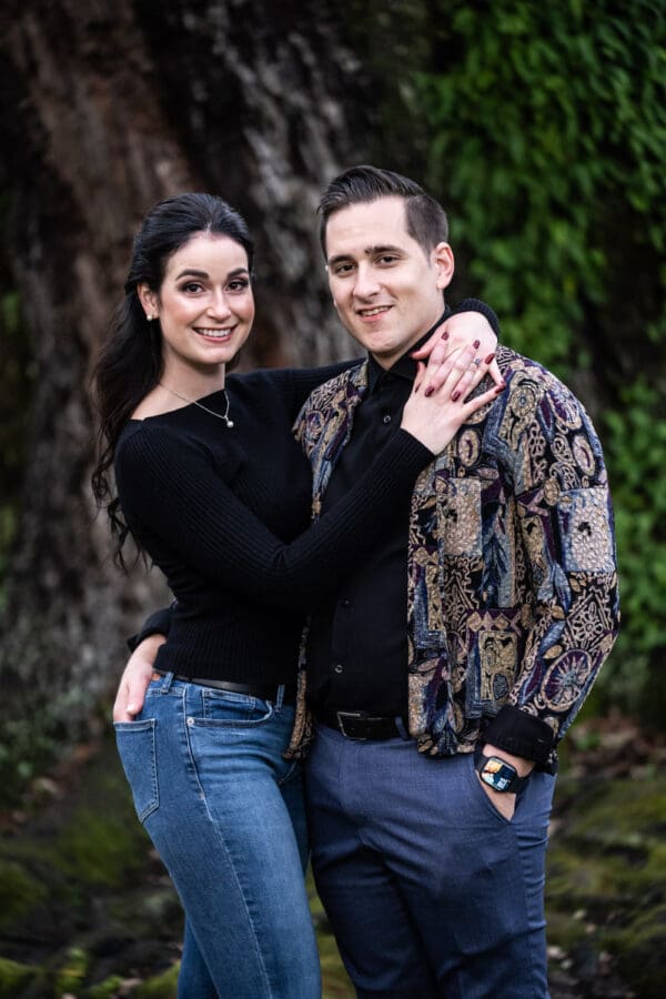 Close-up of couple standing in front of large oak tree at Houmas House engagement portrait