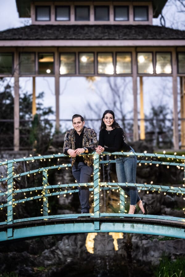 Couple on lit-up bridge at Houmas House engagement portrait