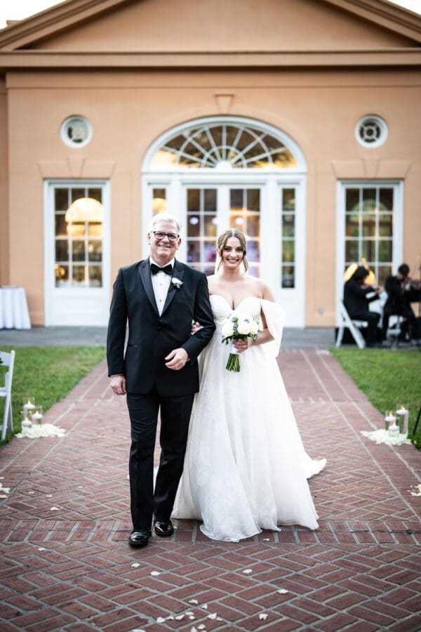 Bride and father walk down the aisle at Pavilion of Two Sisters wedding