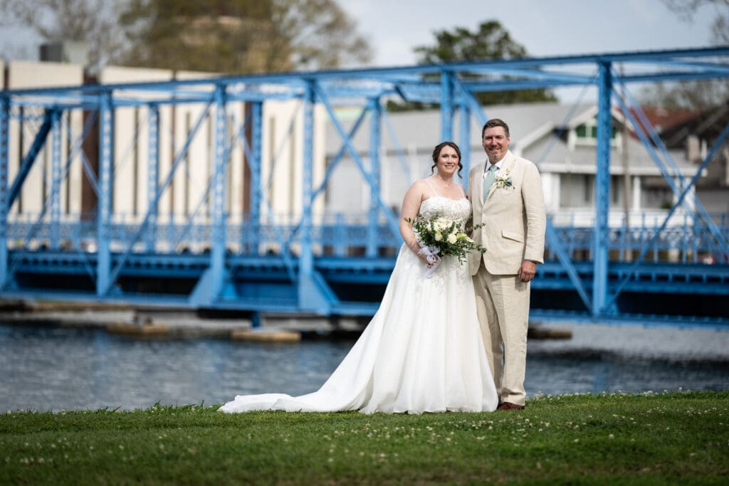 Bride and groom with Magnolia Bridge in the background