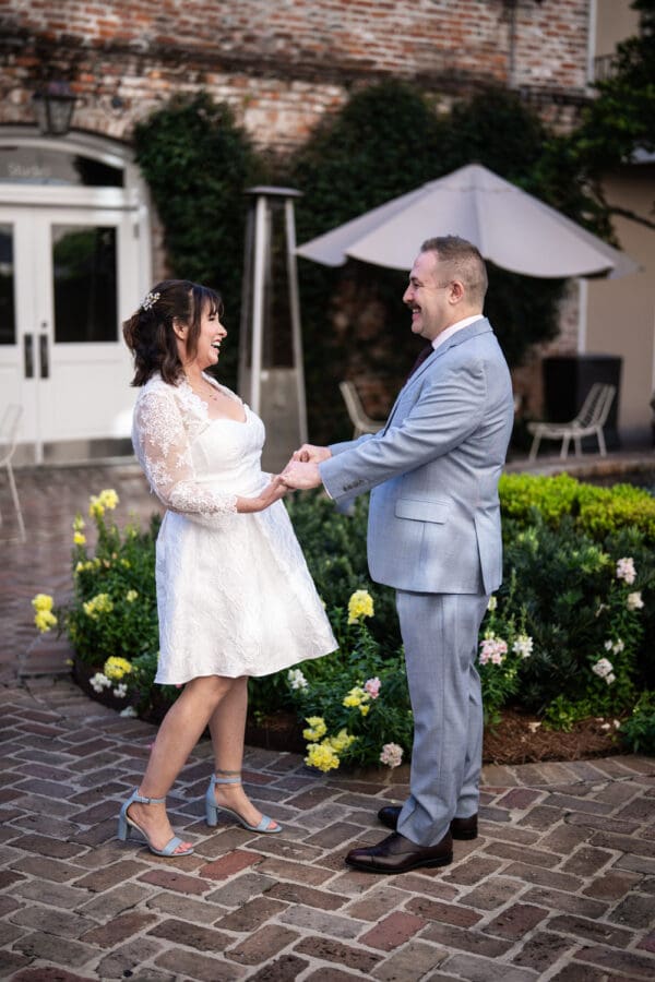 Bride and groom see each other for the first time in Hotel de la Poste courtyard