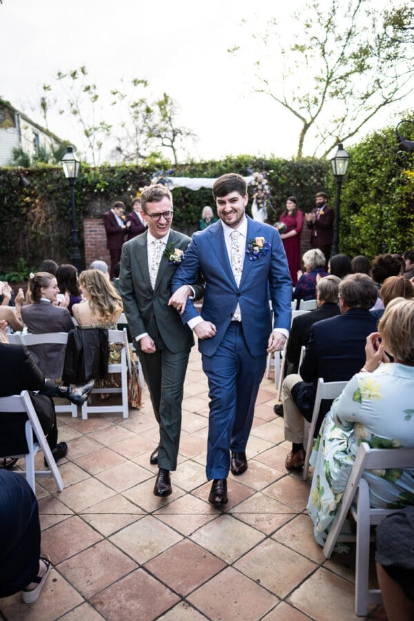 Grooms walk down the aisle