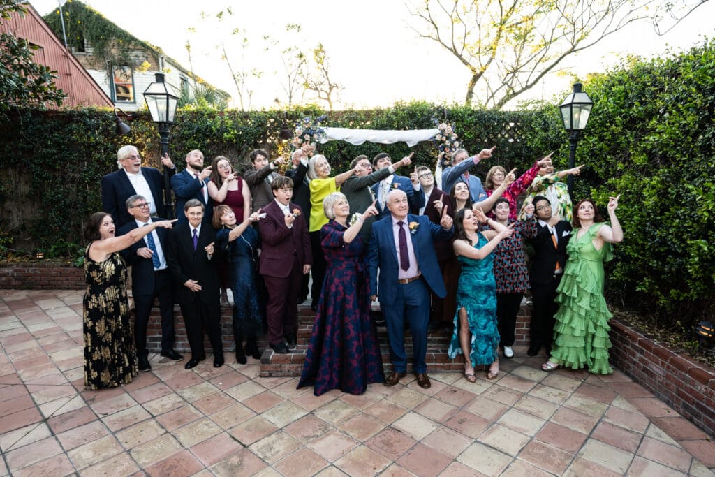 Family members do silly photo at wedding
