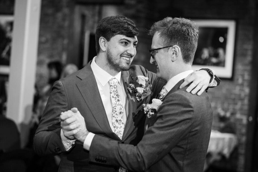 Closeup of grooms having their first dance