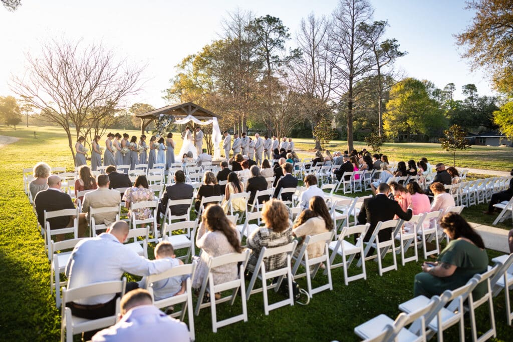 Wedding ceremony at the Sadie Jane in Slidell with golf course in the background