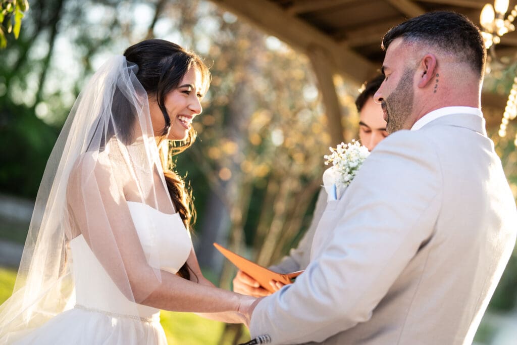 Bride smiles during wedding ceremony