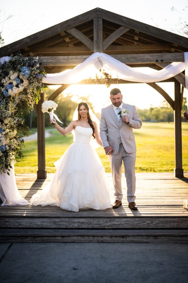 Bride and groom celebrate at conclusion of wedding ceremony