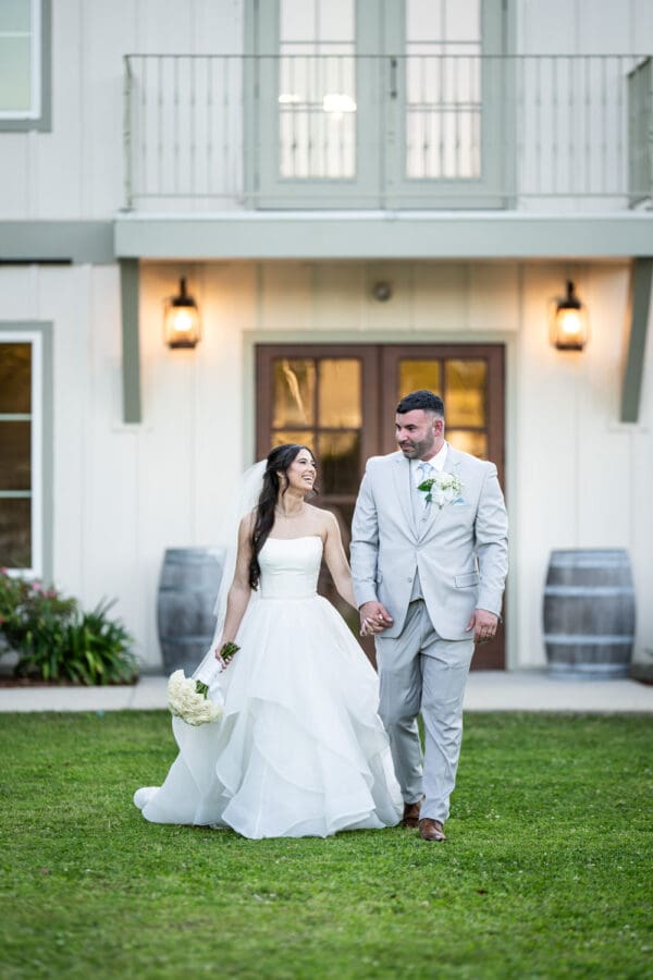 Bride and groom walking in front of Sadie Jane