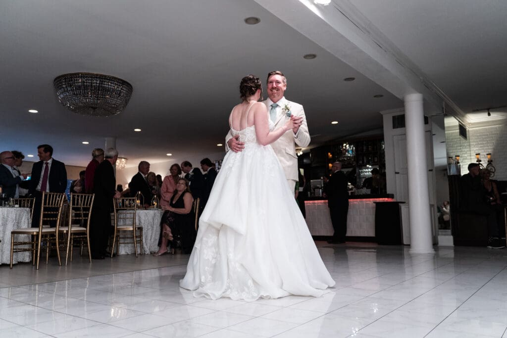 Wide view of bride and groom dancing at Southern Oaks