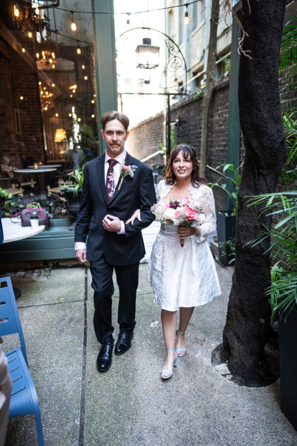 Bride walks up the aisle at Swoop-Duggins House
