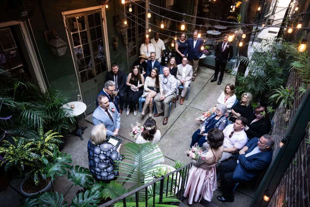 Guests watch wedding ceremony at Swoop-Duggins House