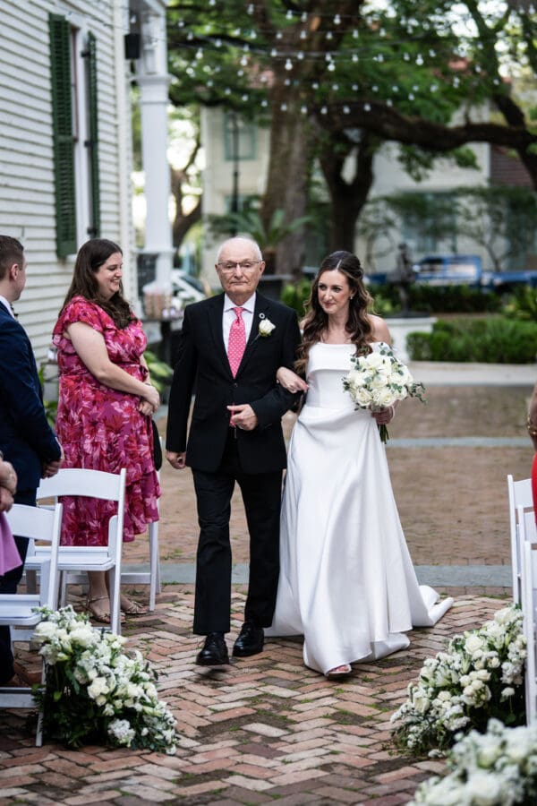 Bride and father walk up the aisle