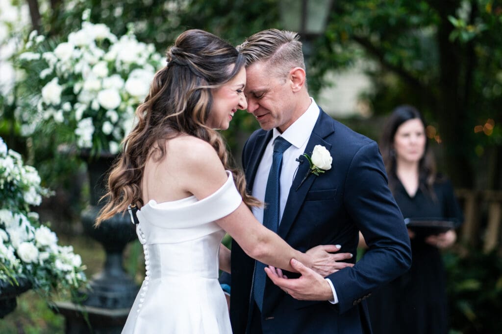 Bride and groom embrace at end of ceremony