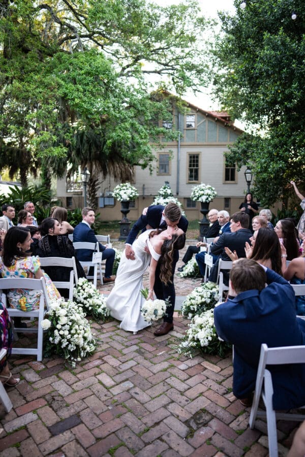 Bride and groom dip in the aisle
