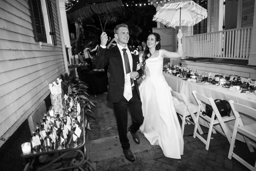 Bride and groom with umbrellas