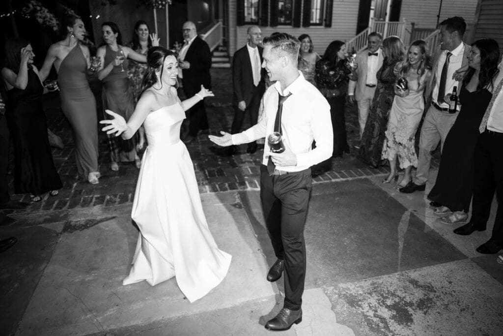 Bride and groom on dance floor with friends