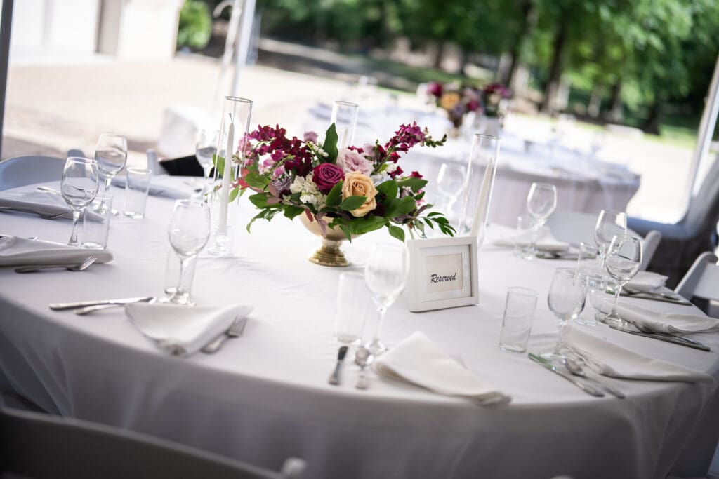 Table with glasses and floral centerpiece