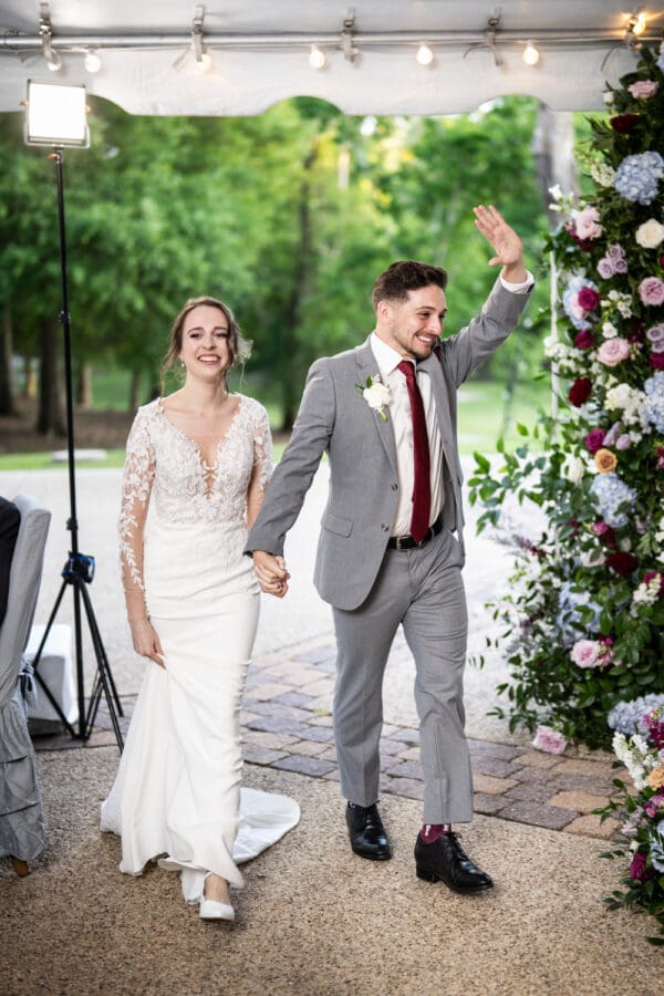 Bride and groom enter reception