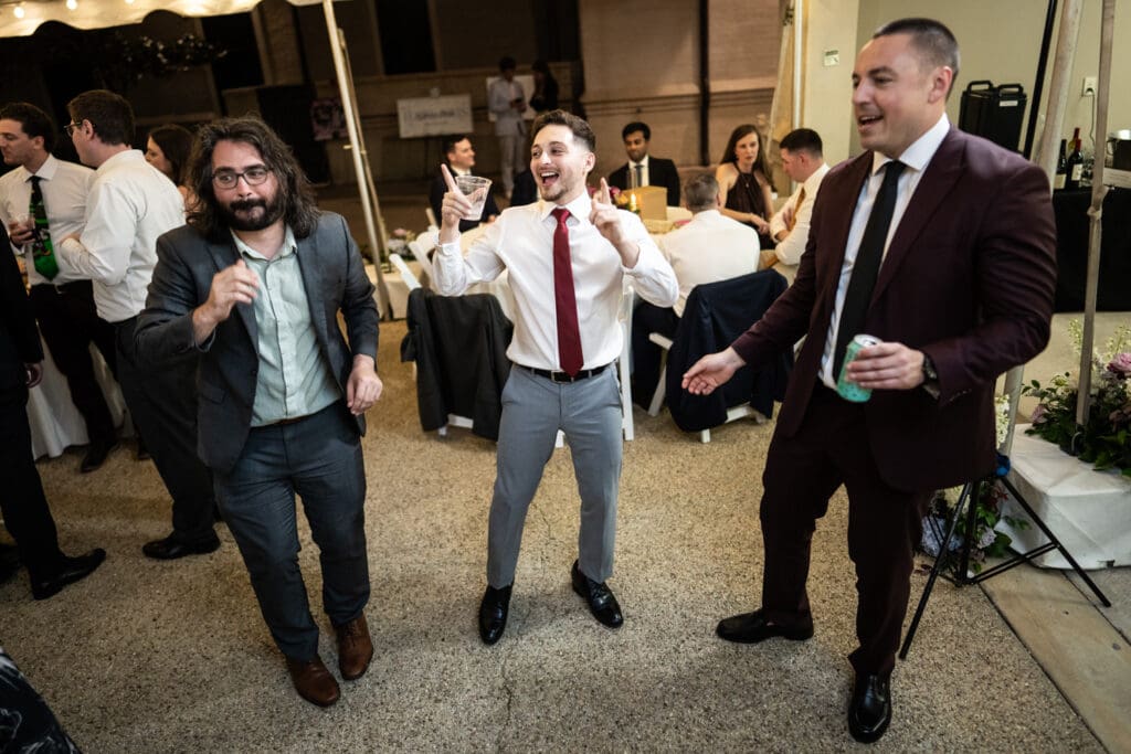 Groom dances with friends