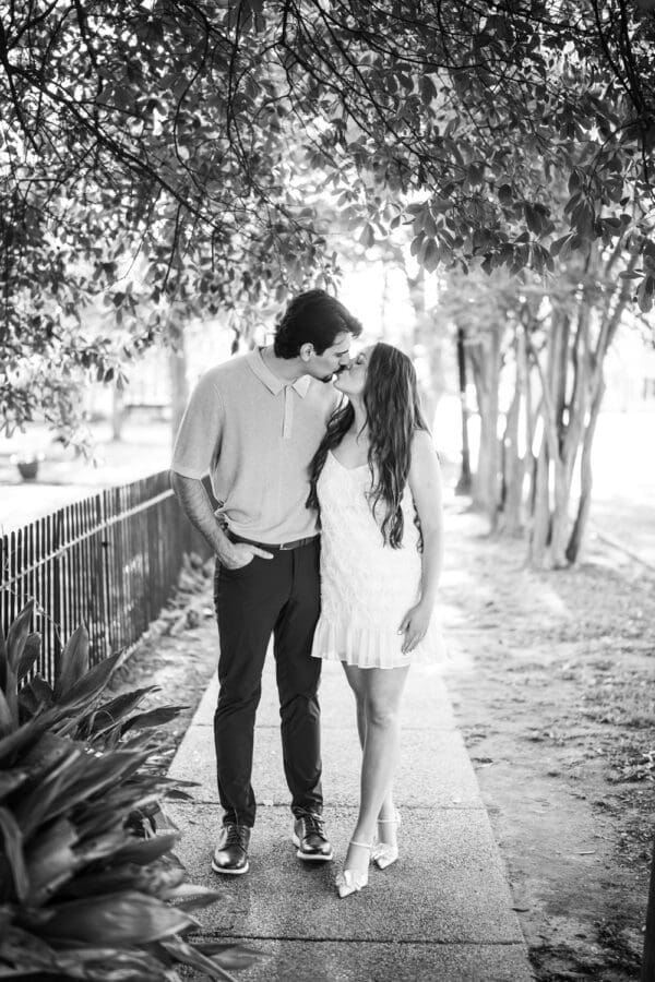 Couple kissing with brilliant sunlight behind them